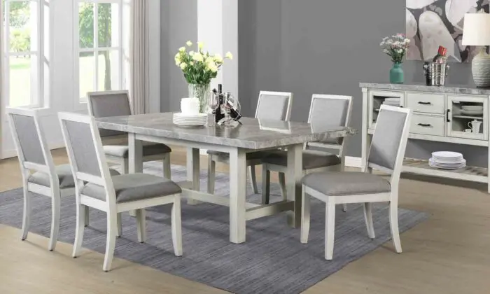 Pine wood dining table with gray marble top and white finish, seating six people comfortably. Cross-stretchers and corner-blocked table top provide stability and durability. 7 piece dining room set with classic, contemporary or farmhouse style.