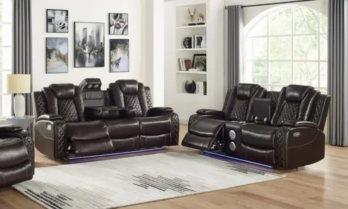 High-tech and comfortable Josua Motion Collection for the living room. Includes sofa with dual recliners, console loveseat with dual recliners, and glider recliner. Manual or power headrest and footrest options available. Coil cushion and hardwood/plywood frame for durability. Storage arms and drop-down center in sofa and loveseat. Sofa features dropdown drink tray, reading light, wireless charger, theater lighting, and Bluetooth speaker. Perfect for adding comfort and convenience to the living room.