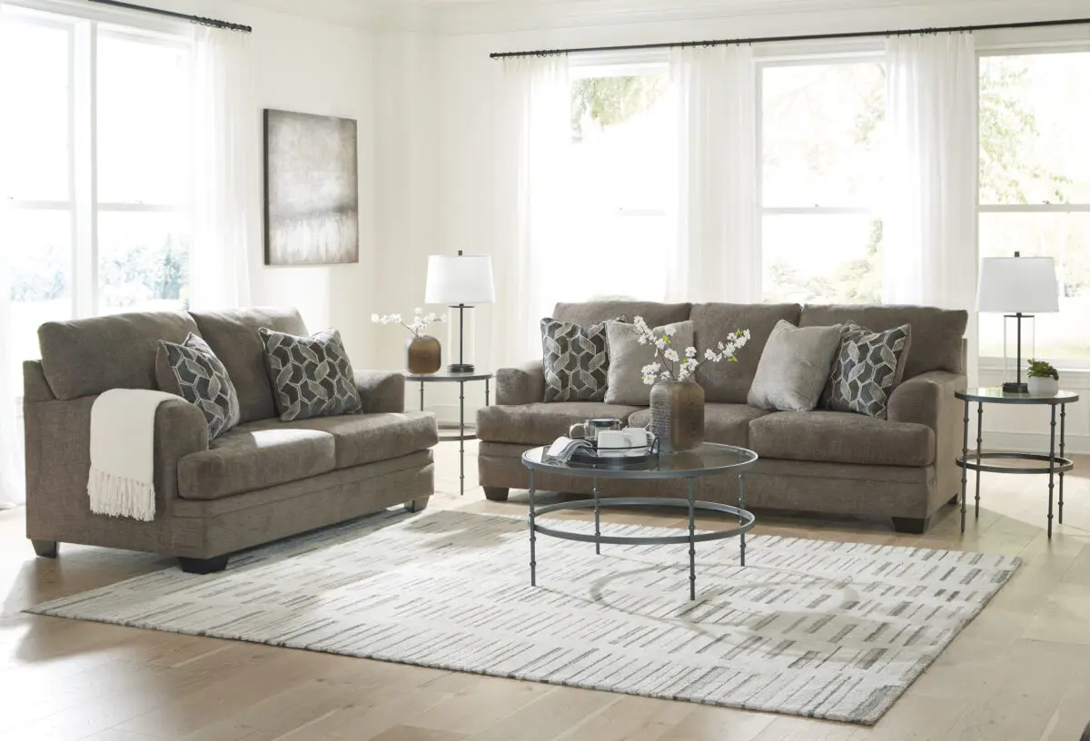 Stonemeade 2 Piece Living Room Set in nutmeg, featuring a sofa and loveseat with accent pillows.