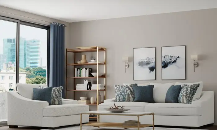 White modern sofa and loveseat set with wood accents in a bright living room