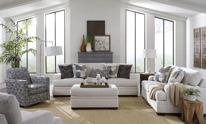 Steinway Dove 2 Piece Living Room Set with grey sofa and loveseat in a bright room.