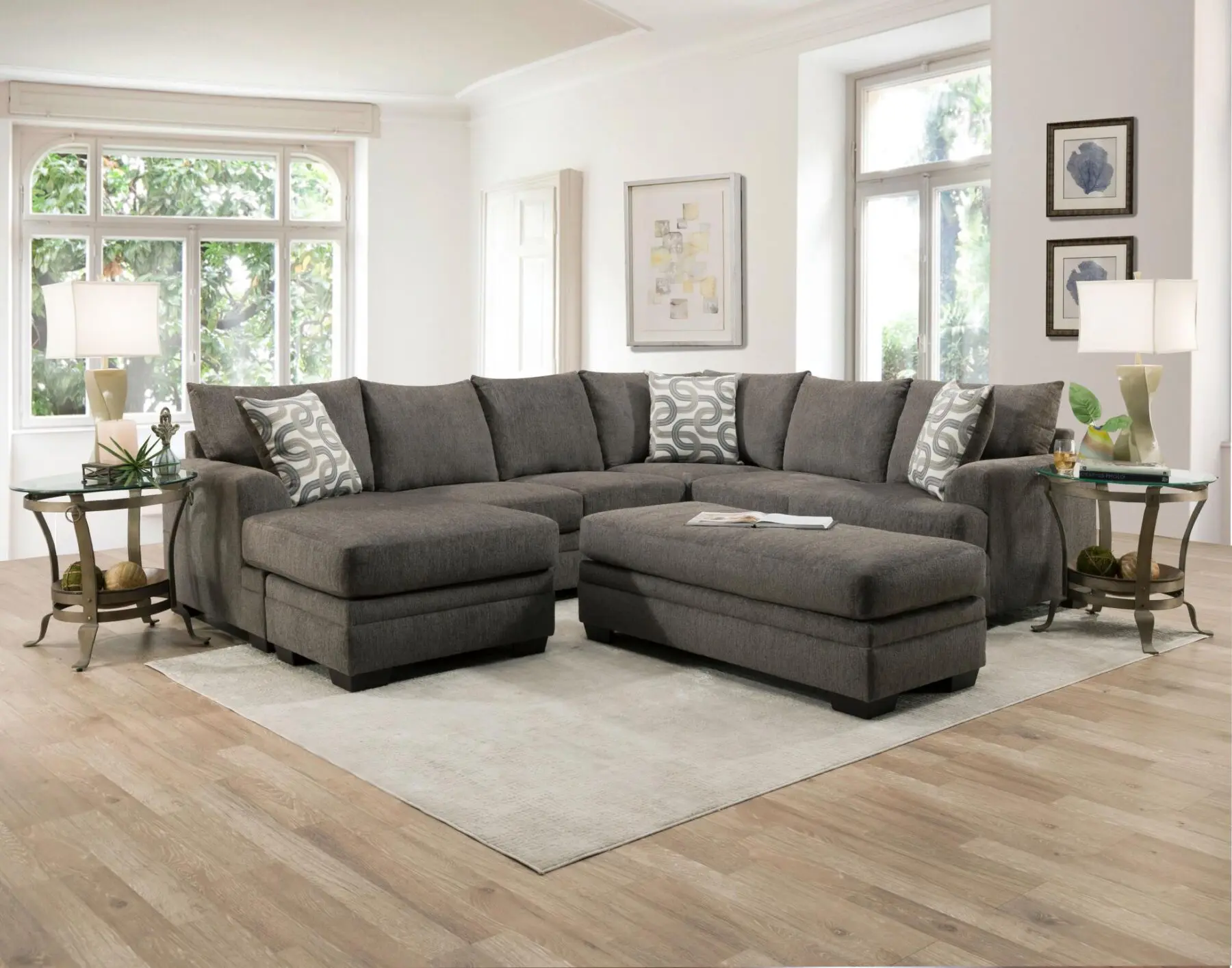 Bailey Charcoal 2 Piece Sectional with Chaise in a bright living room.