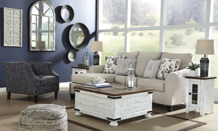 Contemporary polyester-upholstered sofa chaise with loose seat cushions and four coordinating toss pillows. Corner-blocked frame and high-resiliency foam cushions provide durability and comfort. Faux wood finished exposed feet and platform foundation system resist sagging for a wrinkle-free look.