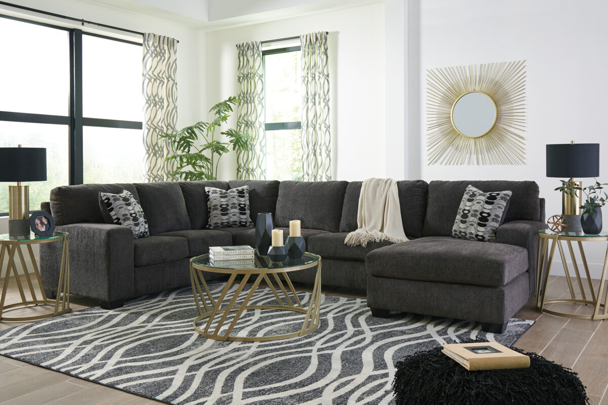 Ballinasloe Smoke 3-Piece Sectional with Chaise, featuring a left-arm facing corner chaise, armless loveseat, and right-arm facing sofa with soft gray polyester upholstery and plush cushions