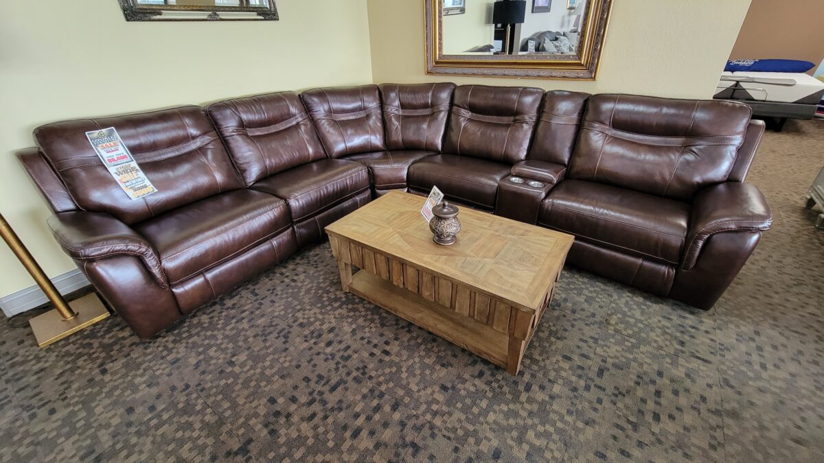 5169 Dark Brown Sectional Living Room Set in top grain leather with modular pieces, manual recliners, and USB-equipped console, designed for comfort and versatility.