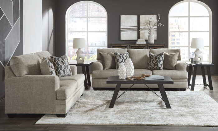 Stonemeade 2 Piece Living Room Set in beige, featuring a sofa and loveseat with accent pillows.