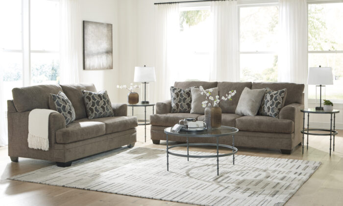 Stonemeade 2 Piece Living Room Set in nutmeg, featuring a sofa and loveseat with accent pillows.