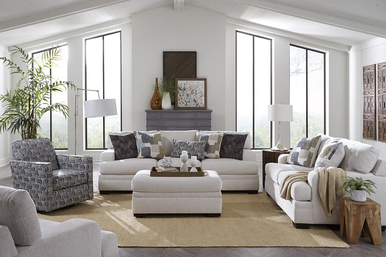 Steinway Dove 2 Piece Living Room Set with grey sofa and loveseat in a bright room.